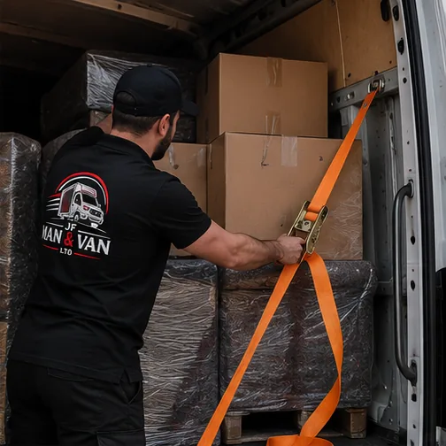 Furniture secured with straps inside a removals van